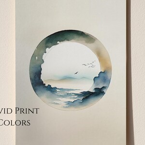 May include: Watercolor print featuring a circular landscape scene with a serene sky, mountains, and water. The artwork is framed by a dark green and blue ring, with a few birds in flight. The text "VIVID PRINT COLORS" is printed at the bottom.