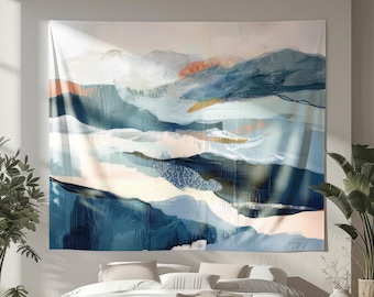 May include: Abstract landscape tapestry featuring a blend of blues, whites, and touches of orange and gold. The artwork depicts a stylized mountain range with flowing, layered forms. The tapestry is hung above a bed, adding a decorative element to the room.