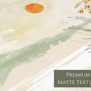 May include: Abstract art print with a green and white mountain range, a large orange sun, and a few brown branches in the upper right corner. The print has a premium matte texture.