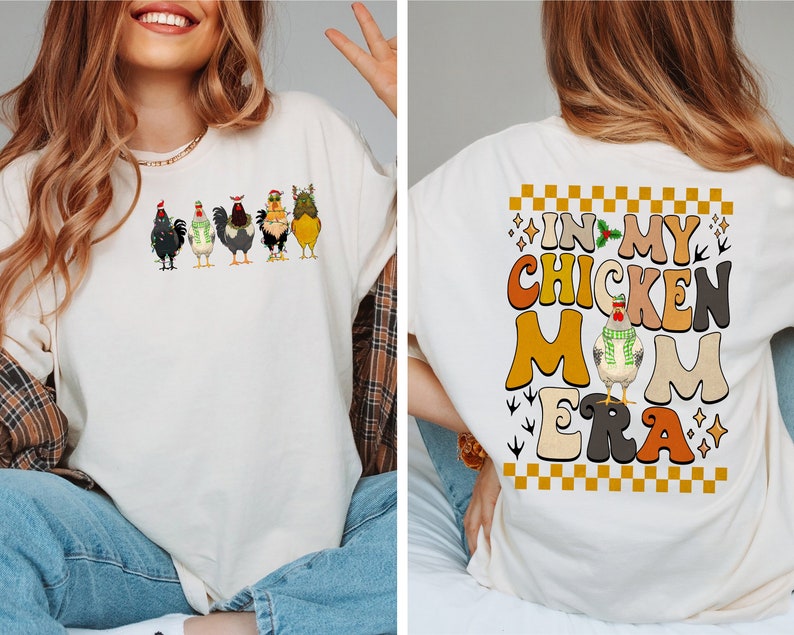 May include: A white t-shirt featuring a graphic of five chickens adorned in festive attire. The back of the shirt displays the text "In My Chicken Mom Era" in a retro font with a checkered pattern.