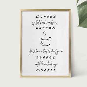 May include: A framed print with a gold border. The text reads "COFFEE spelled backwards is EEFFOC" and "Just know that I don't give EEFFOC until I've had my COFFEE." A simple line drawing of a coffee cup is in the center.