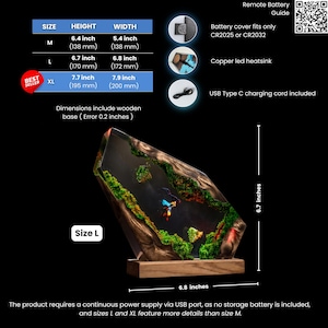 May include: A decorative resin and wood lamp featuring a miniature landscape with green moss and a central figure, mounted on a rectangular wooden base. Size L measures 6.7 inches in height and 6.8 inches in width. Includes a USB Type C charging cord.