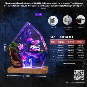 May include: A resin lamp with a wooden base, featuring a miniature landscape with moss, pink plants, and glowing purple mushrooms. It includes an RGB LED light, a remote, and a USB port. The size L model measures 5.1 inches wide and 6.5 inches high.
