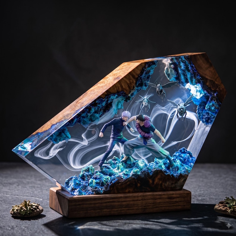 May include: A decorative resin and wood sculpture featuring two anime-style figures in a combat pose. The piece incorporates blue crystalline textures, swirling white smoke effects, and small winged creatures encased within a clear, angled block.
