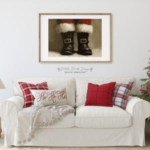 May include: A digital print of Santa's boots with the text "Ho Ho Ho" on a white couch with red and black plaid pillows.