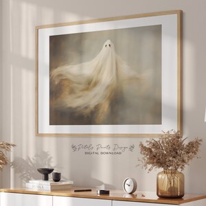 May include: A digital download of a printable art print featuring a white ghost with a flowing, ethereal form against a muted brown and beige background.