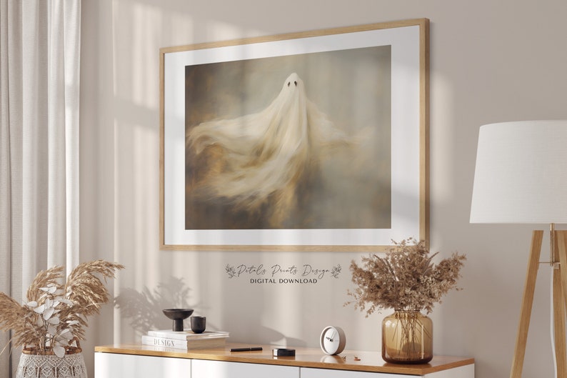 May include: A digital download of a printable art print featuring a white ghost with a flowing, ethereal form against a muted brown and beige background.
