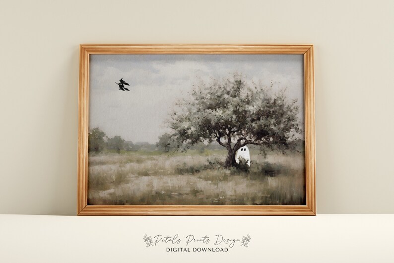 May include: A digital download of a painting depicting a white ghost standing behind a tree in a field with two black witches flying in the sky. The painting has a muted color palette of grays, greens, and browns.