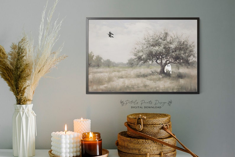 May include: A digital download of a watercolor painting featuring a white ghost hiding behind a tree in a field. Two black birds fly overhead. The painting has a soft, muted color palette.