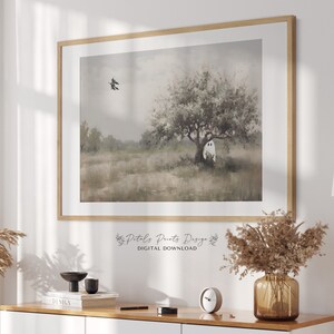 May include: A digital download of a watercolor painting featuring a white ghost in a field with a tree and a bird flying overhead. The painting has a soft, muted color palette.