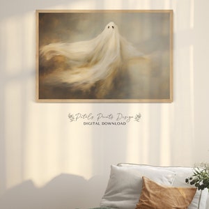 May include: A digital download of a printable art print featuring a white ghost with a flowing, ethereal form against a muted brown and grey background. The text "Pit-a-Pat Prints Design" and "DIGITAL DOWNLOAD" is visible below the image.
