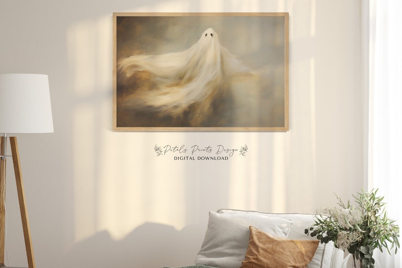 May include: A digital download of a printable art print featuring a white ghost with a flowing, ethereal form against a muted brown and grey background. The text "Pit-a-Pat Prints Design" and "DIGITAL DOWNLOAD" is visible below the image.