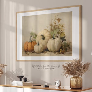 May include: A digital download print of a vintage illustration of four pumpkins, two white and two orange, with fall leaves in the background. The print has the text "Petals Prints Design" and "DIGITAL DOWNLOAD" at the bottom.