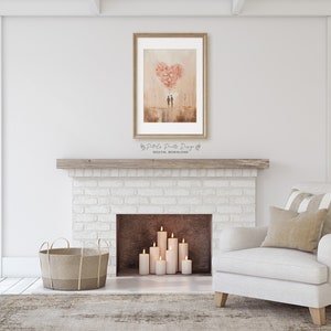 May include: A digital download of a watercolour painting depicting a couple standing in front of a heart-shaped balloon made of pink flowers. The painting is framed and displayed above a white brick fireplace in a living room setting.