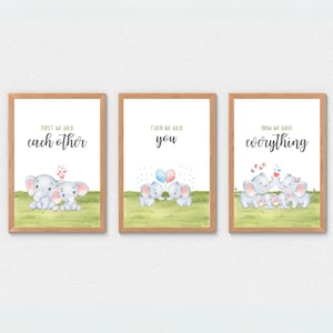 May include: Three framed prints with watercolor illustrations of elephants. The first print reads "First we had each other," the second "Then we had you," and the third "Now we have everything." Each print features a different elephant family composition.