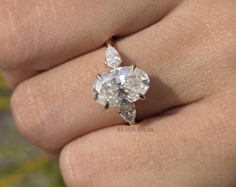 Trilogy Engagement Ring Oval Moissanite Trilogy Ring, Pear Side Stones, 18k Gold Anniversary Ring Pear Side Stone Oval Moissanite Ring