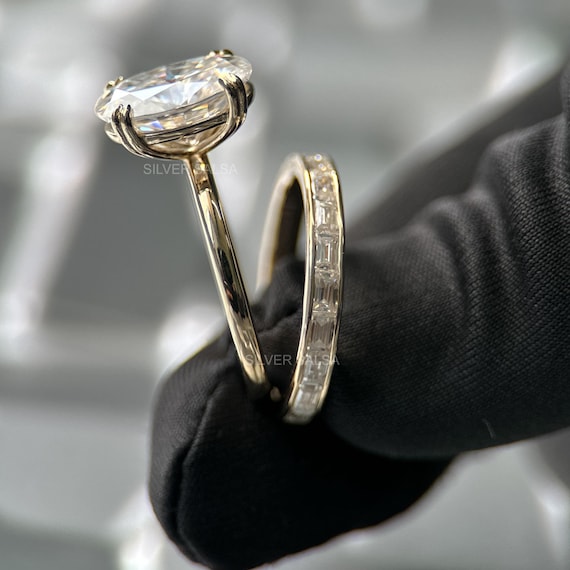 Oval Cut Moissanite Solitaire Ring With Baguette Cut Moissanite