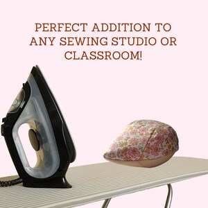 May include: A black and silver iron and a floral print hat on a striped ironing board. The text reads: PERFECT ADDITION TO ANY SEWING STUDIO OR CLASSROOM!