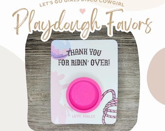 May include: Pink playdough container with a white card that says "Thank you for ridin' over!" with a disco ball and a cowgirl silhouette. The card also says "Love Ashley".
