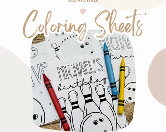 May include: Black and white coloring sheets with a bowling theme. The sheets feature bowling pins and a bowling ball. The text "Michael's birthday" is written on one of the sheets. Crayons are included in the image.