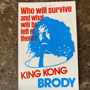 May include: A white rectangular print with red and blue text. The text reads "Who will survive and what will be left of them?" above a blue illustration and the words "KING KONG BRODY".