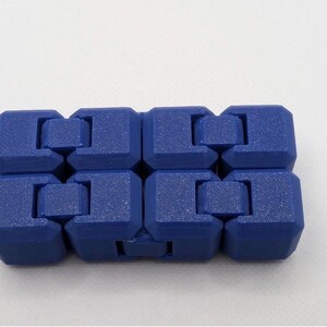 May include: A blue fidget toy composed of eight connected, cube-shaped segments. Each segment has a textured surface and is interlocked with the adjacent ones, allowing for flexible movement. The toy is designed for tactile engagement.