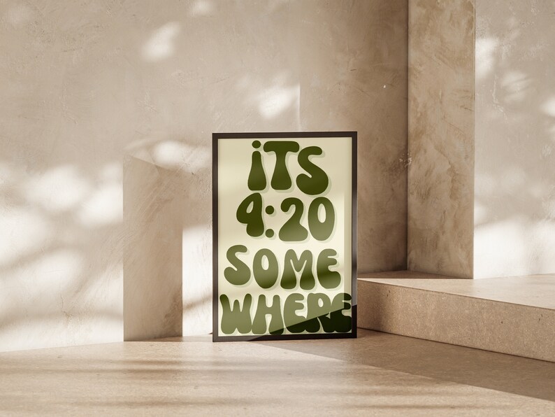 May include: A framed print with a light yellow background and green text that reads "ITS 4:20 SOMEWHERE".