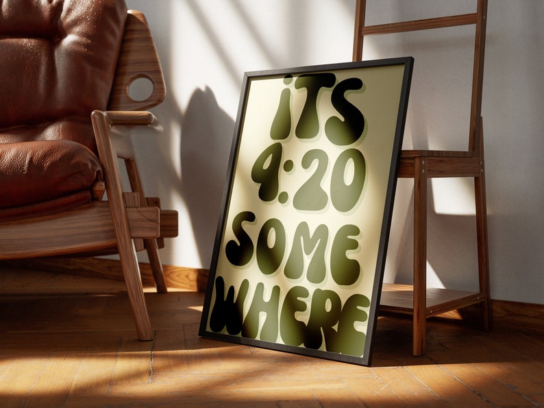 May include: A framed print with a yellow background and black text that reads "ITS 4:20 SOMEWHERE". The text is in a retro, bubbly font.