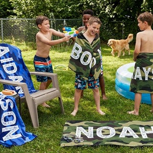 Kids playing with personalized name towels outdoors, summer present boy bath wrap personalized name gift custom summer camp birthday favor pool party gift for little boy
