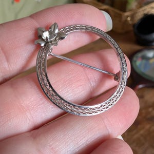 Vintage silver tone, possible HEDY brooch, wreath, circle with flower