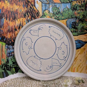 Vintage studio pottery plate with farm animals, salt glaze