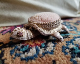 Vintage pink turtle pincushion, pinky colored velvet in a gold tone and white swaying turtle base, pink rhinestone eyes, Florenza, NYC