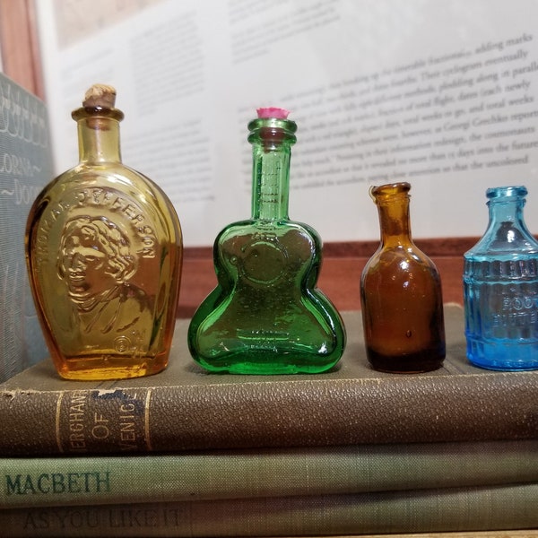 Vintage bitters bottles, sold individually, blue barrel, brown bottle, green guitar bottle, amber Thomas Jefferson bottle, glass