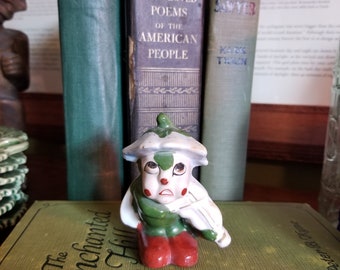 Vintage white ladybug figurine, playing a violin or viola, made in occupied Japan between 1945-52, red shoes, green body, flower on head