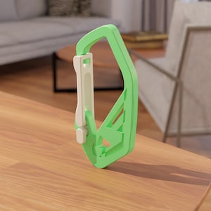 May include: A green and white plastic carabiner with a spring-loaded gate. The carabiner is designed for attaching items to a belt loop or backpack.