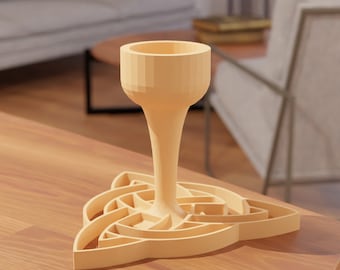 May include: A wooden goblet with a Celtic knot design base. The goblet is light brown and has a smooth, rounded shape.