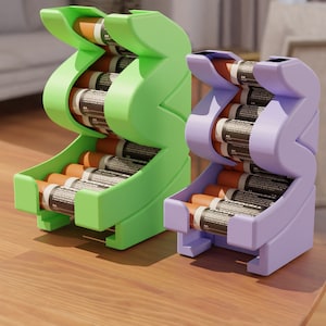 May include: Two battery organisers, one green and one purple, with multiple AA batteries inside. The organisers are made of plastic and have a zig-zag design.