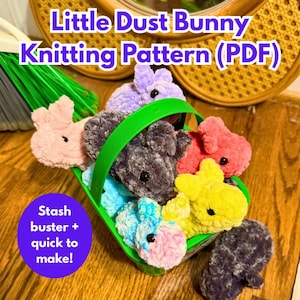 May include: A green basket overflowing with soft, knitted bunny toys in various colours, including pink, purple, grey, red, yellow, and blue. The image includes text: "Little Dust Bunny Knitting Pattern (PDF)" and "Stash buster + quick to make!"