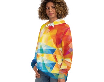 May include: A hooded sweatshirt with a vibrant abstract design. The hoodie features a colorful pattern of geometric shapes in shades of yellow, orange, blue, and white. It has a drawstring hood and a front pocket. The garment is made of a soft material.