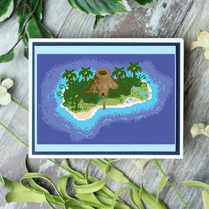 May include: A pixel art print depicting a tropical island with a thatched-roof hut, palm trees, and sandy beaches. The island is surrounded by blue water. The artwork is framed in a white and blue border, creating a digital paradise feel.