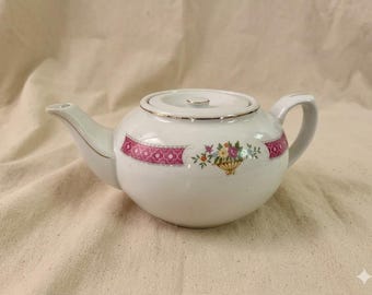 Vintage roze porseleinen theepot met bloemen, plat deksel en gouden accenten