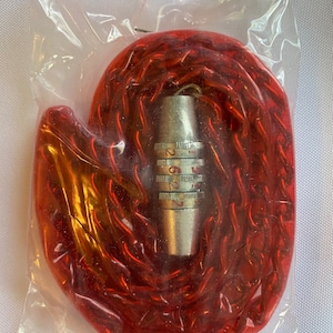 May include: A red chain with a silver combination lock. The lock has three dials with numbers 1-9.