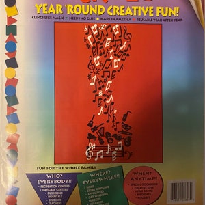 May include: A red, white, and blue package of Stik-Ees reusable stickers with a musical theme. The package features a design of musical notes and instruments. The text on the package reads "Stik-Ees Year 'Round Creative Fun!" and "Simply Music Code 808".