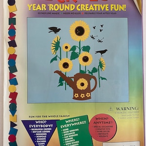 May include: A colorful sticker sheet with a sunflower design. The sheet includes a watering can, sunflowers, bees, and dragonflies. The text on the sheet reads "Stik-Ees Year 'Round Creative Fun!" and "Sunflower Sensation Code 106".