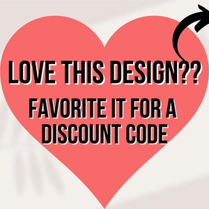 May include: A red heart shape with the text "LOVE THIS DESIGN?? FAVORITE IT FOR A DISCOUNT CODE" in black and white. A black arrow points towards the text. The background is a light, off-white color.