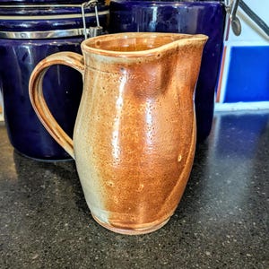 Oranje geglazuurde kan, op wiel gegooide kan, handgemaakte kan, huwelijkscadeau, cadeau voor moeder, keramische kan, kunstzinnige kan, oranje creamer