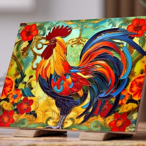 May include: A colorful ceramic tile featuring a rooster with a red comb and wattle, blue and black feathers, and a yellow and red body. The rooster is surrounded by green and gold floral designs and red flowers.