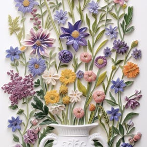 May include: A white ceramic vase with intricate floral designs, filled with a variety of colorful paper flowers, including purple, pink, yellow, and blue.