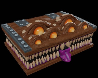 May include: A wooden box with a monstrous face carved into the lid. The face has multiple eyes and a large, purple tongue sticking out. The box is decorated with metal accents.