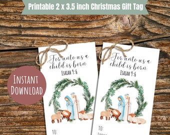 May include: Two printable 2 x 3.5 inch Christmas gift tags with a watercolor illustration of the nativity scene. The text on the tags reads "For unto us a child is born. Isaiah 9:6".